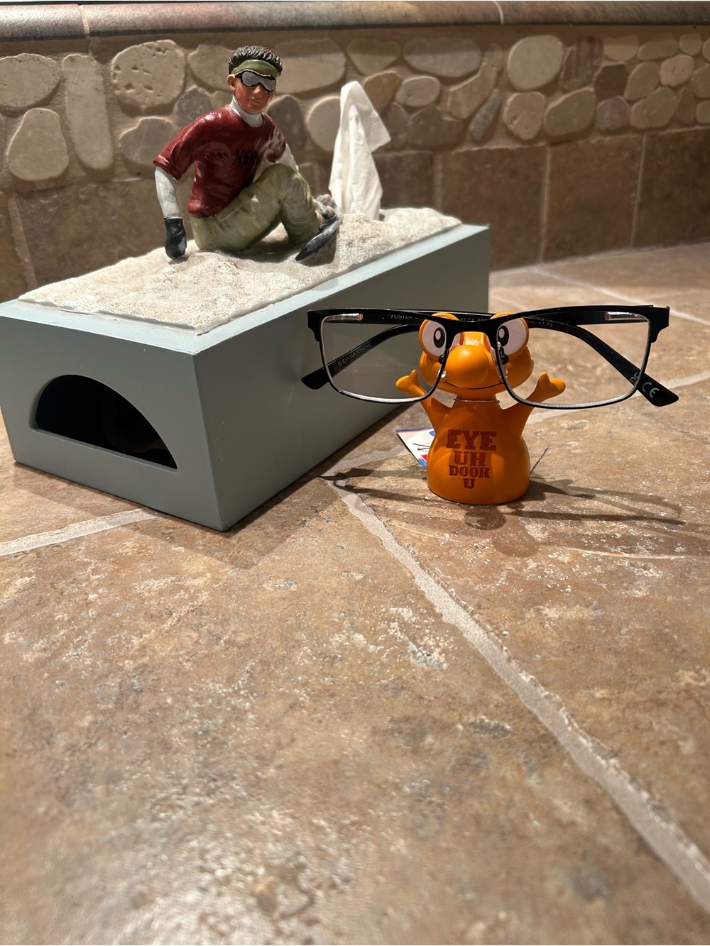 Snowboarding tissue holder with orange figurine eyeglass holder!